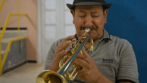 A raï artist plays the trumpet